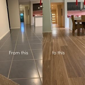 Before and After Flooring Transformation Singapore by Professional Handyman: Changing grey tiles to warm wood laminate flooring.